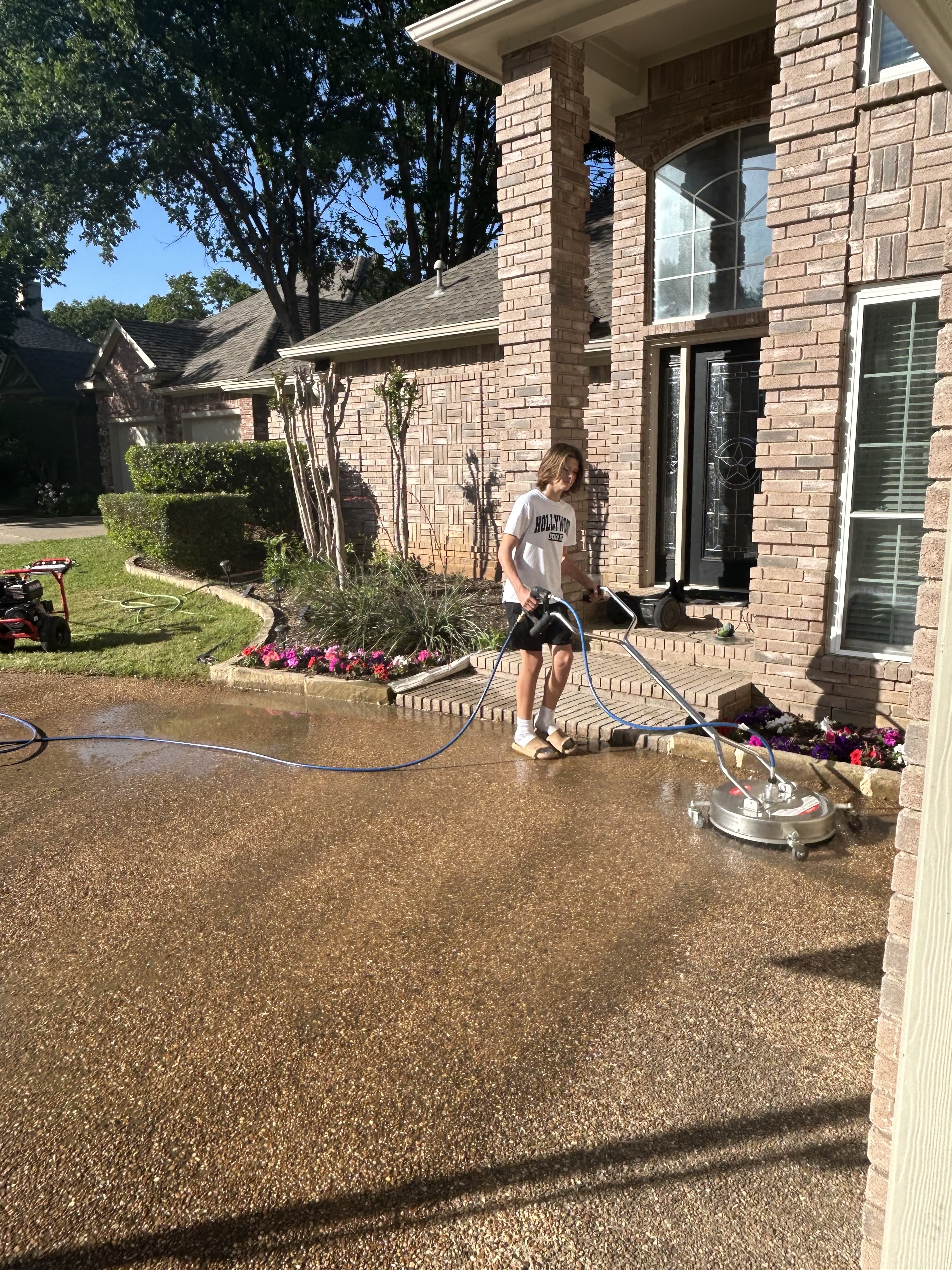 neighborhood boys washing a patio